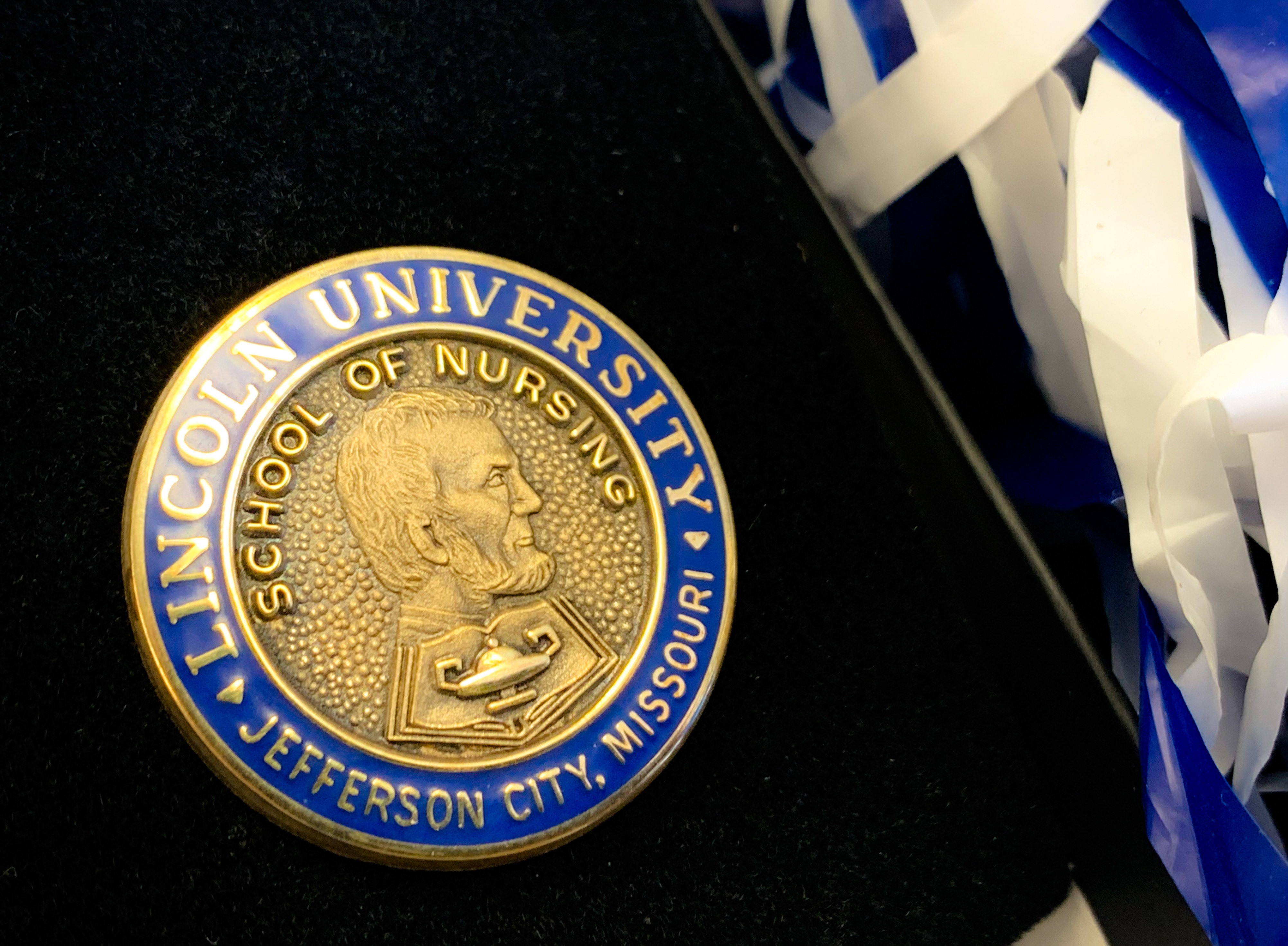 Nursing students receive a pin to mark the beginning of their healthcare careers.