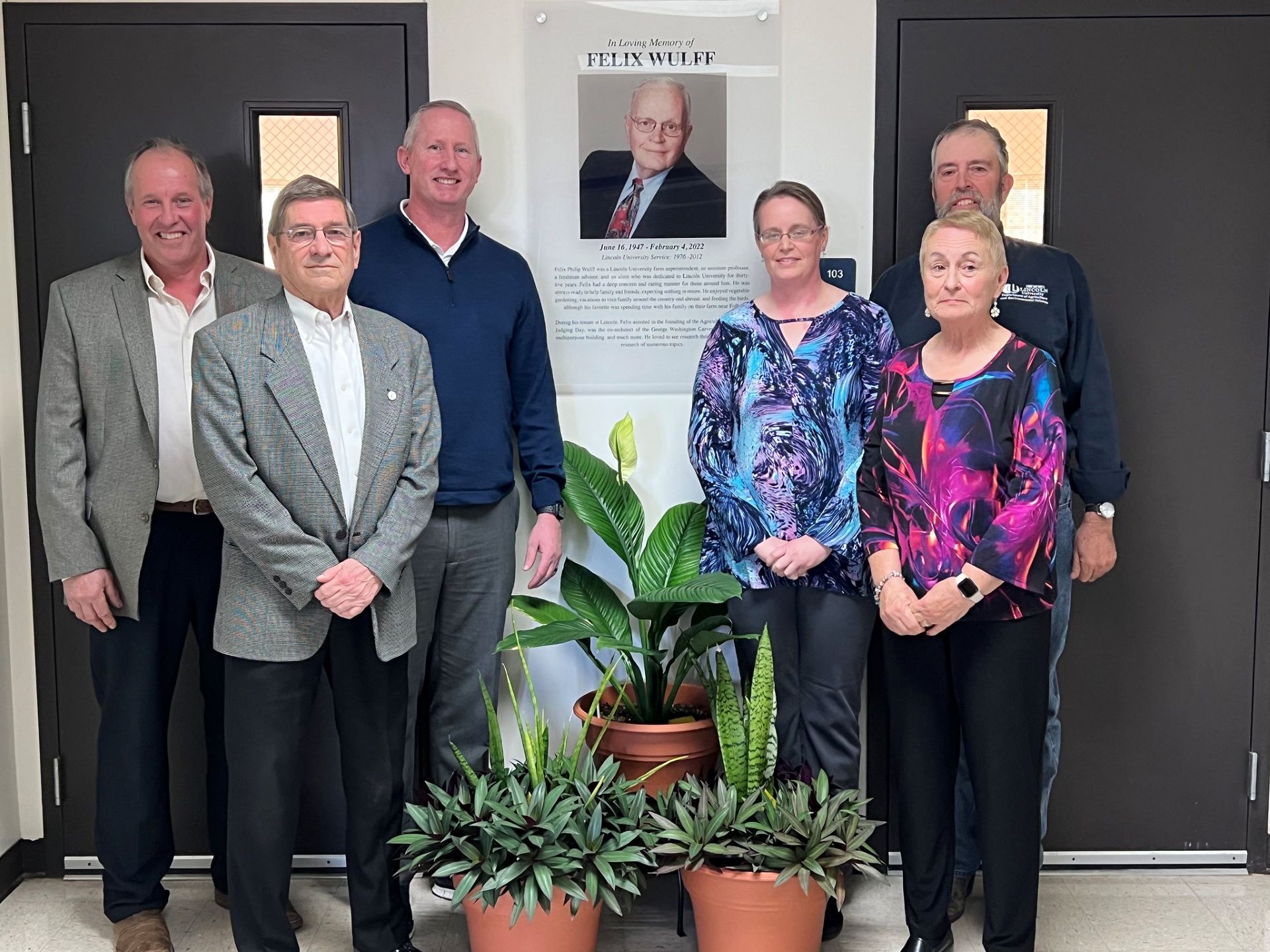Lincoln University of Missouri honored former employee Felix Wulff with a plaque in the George Washington Carver Farm multipurpose room. Pictured left to right: Chris Boeckmann, LU farm superintendent; LU Curator Terry Rackers; LU President John, B. Moseley; Lisa Wulff, Wulff’s daughter; Joann Wulff, Wulff’s wife; and Doug Moeller, LU farm technician.