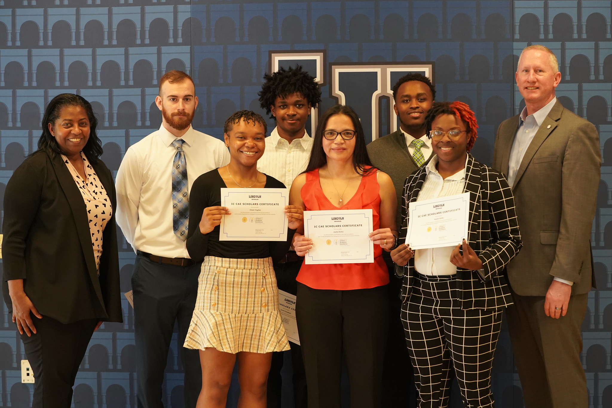 Lincoln University of Missouri students were recognized by the Midwest Consortium – Intelligence Community Center for Academic Excellence on March 31 for their achievements as IC CAE Scholars at a pinning ceremony on Lincoln’s campus. Pictured left to right: Jennifer McCann, Deputy Chief, Emerging talent Group of Intelligence Community Human Capital; Scholars - Blake Oakley, Chyler Hughes, Jared Campbell, Jovita ‘Iris’ Desha, Alexandre Mugisha, Assata Starks; LU President Dr. John B. Moseley. 