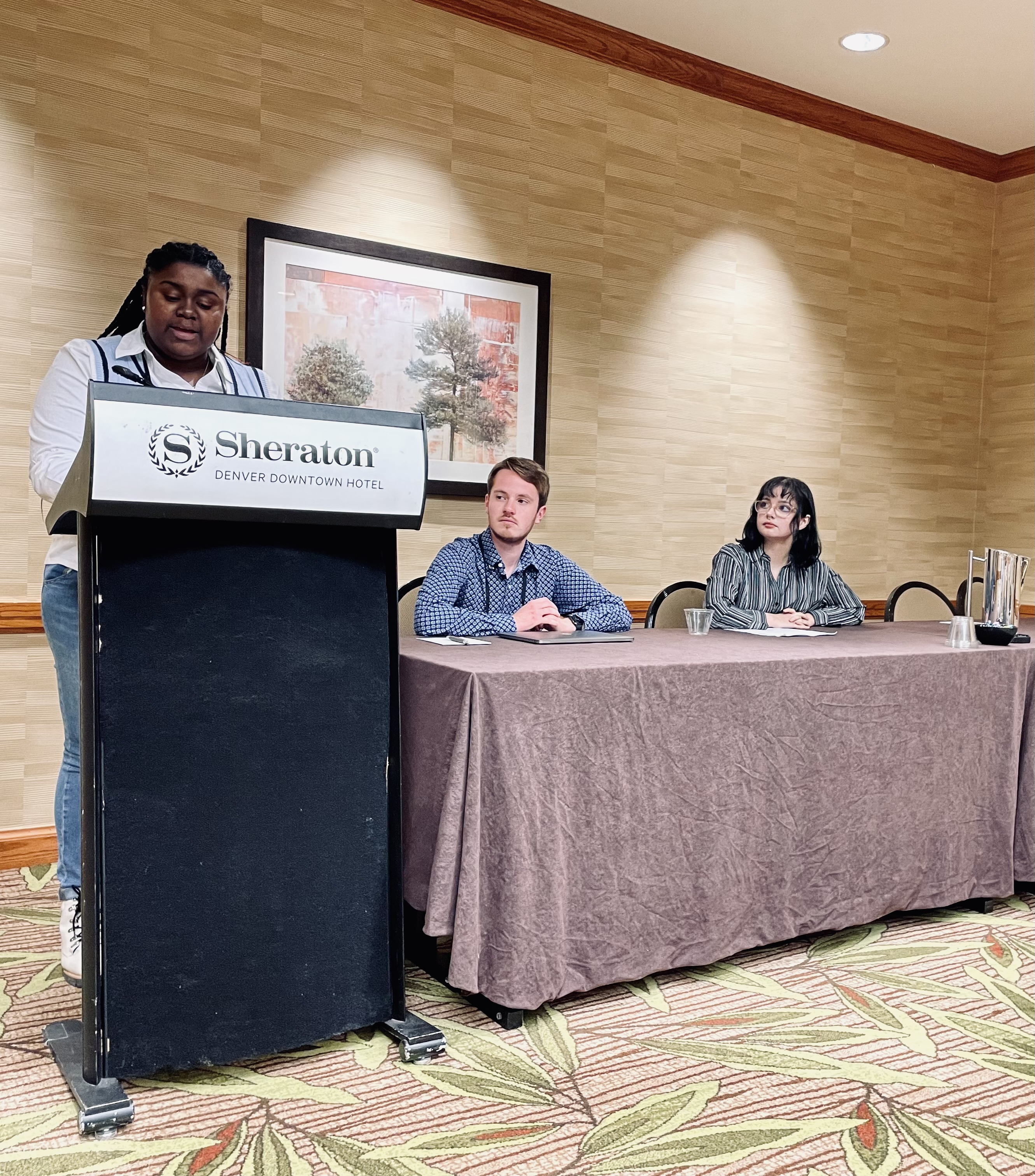 Junior Chenia Walker reads from her critical essay on Langston Hughes’ poetic stylings and his poetry’s connections to the Blues genre.