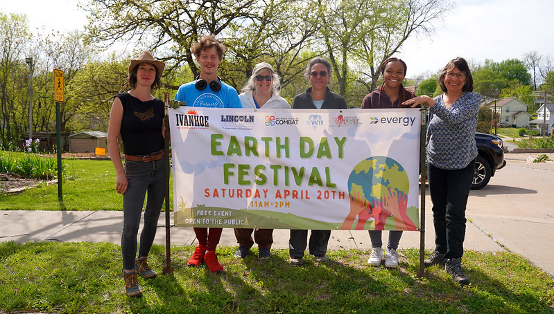 INC’s Nadine Donovan (left) and SCP team members Joshua Lawrence, Sue Bartelette, Tina Wurth, Chyler Hughes and Nadia Navarrete-Tindall (right) welcome the public to Earth Day Festival.