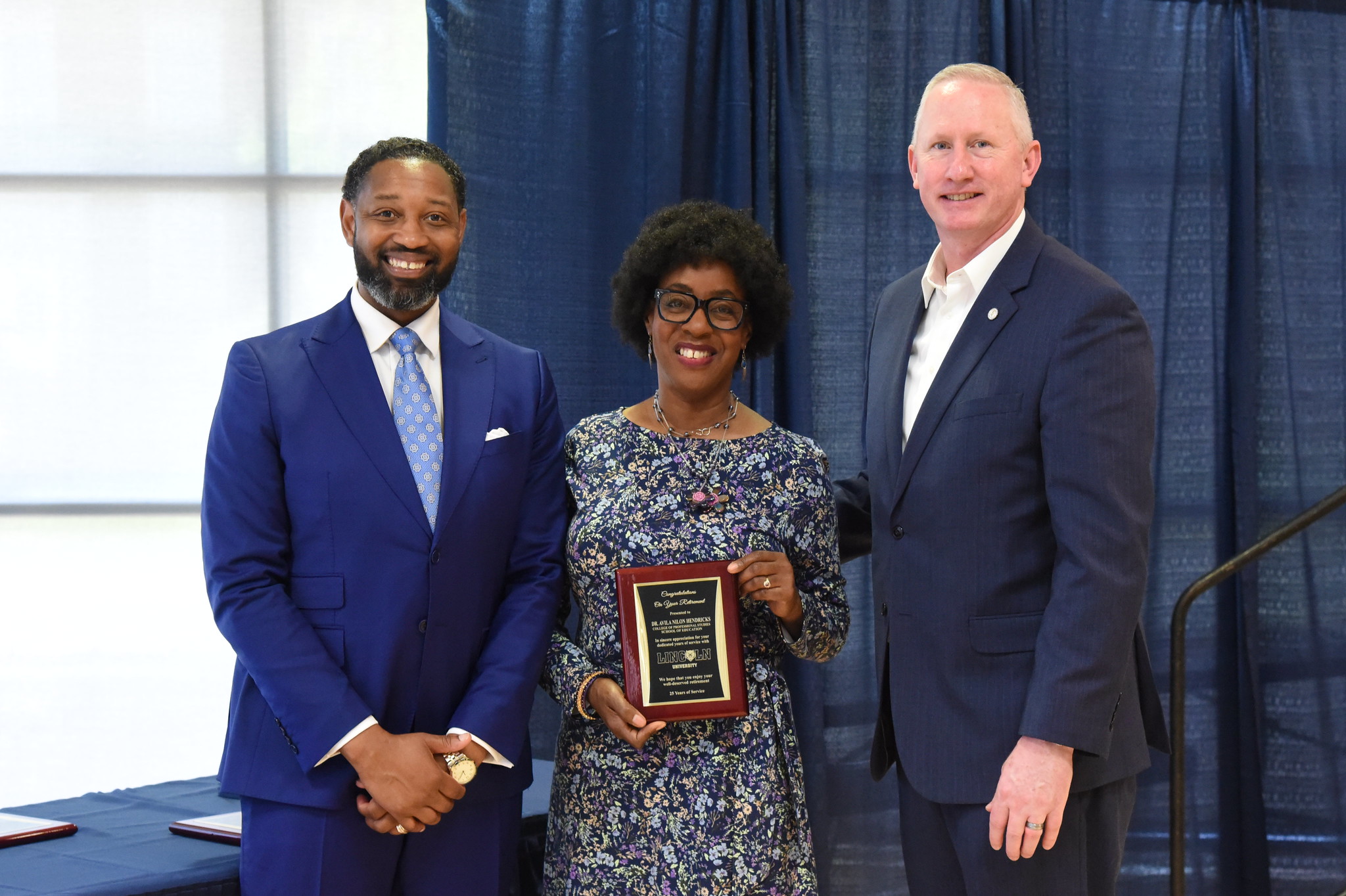 Dr. Avila Hendricks with President Moseley and Stevie Lawrence at the Faculty Awards and Appreciation Luncheon.