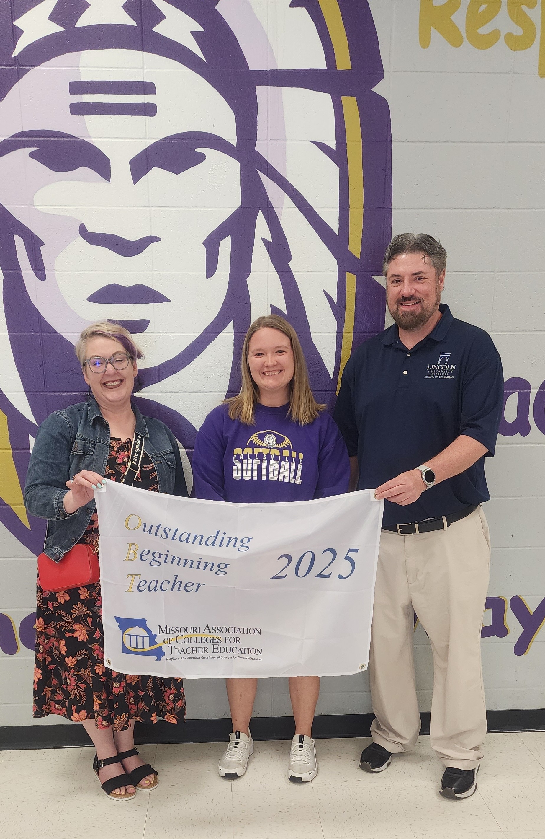 Maddison Welker (middle) celebrates winning the MACTE OBT Award with Dr. Adria Waters (left) and Dr. Chad Kish (right) from Lincoln University