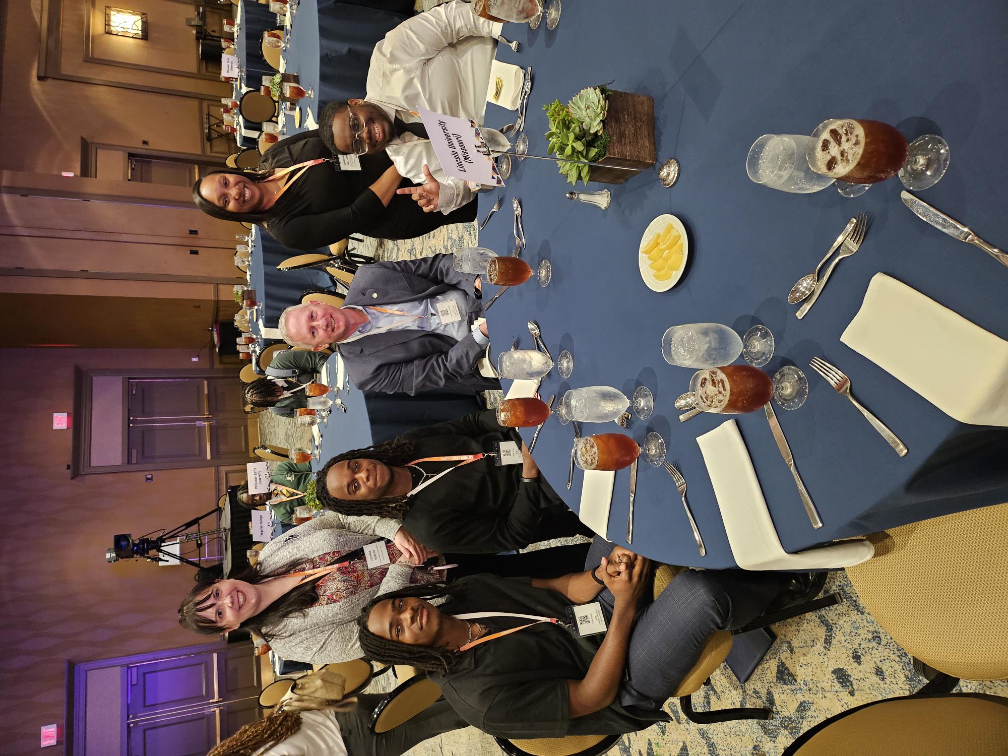 Lincoln University of Missouri Strada Scholars with LU faculty at a banquet event.