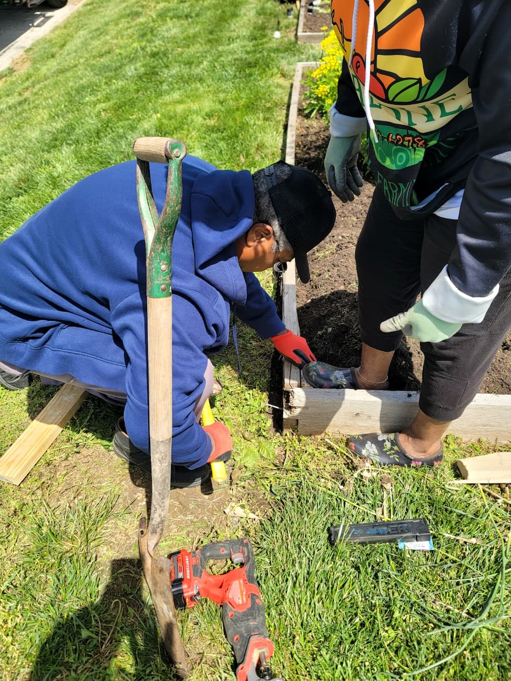 Urban Green Dreams brings people together to prepare a raised garden bed at a site in Kansas City.