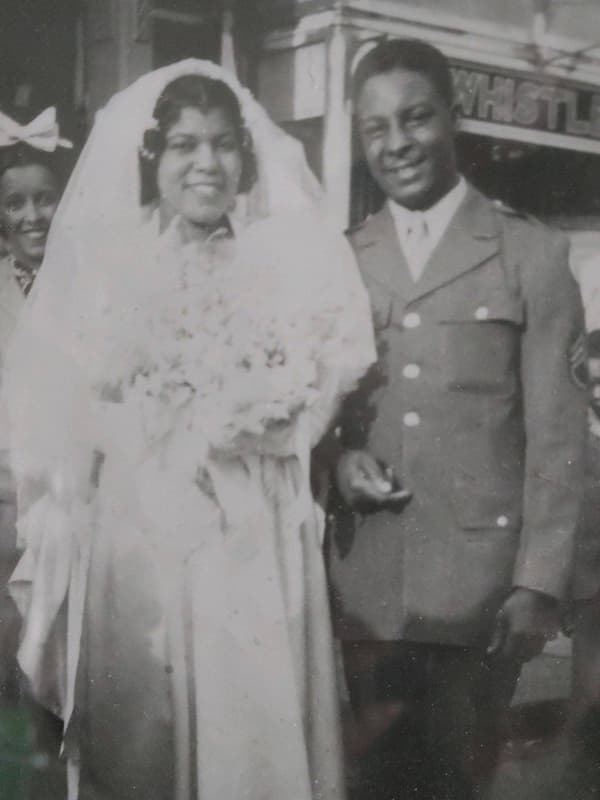 Black and white photo of Robert Sams Jr. and his wife at their wedding. 