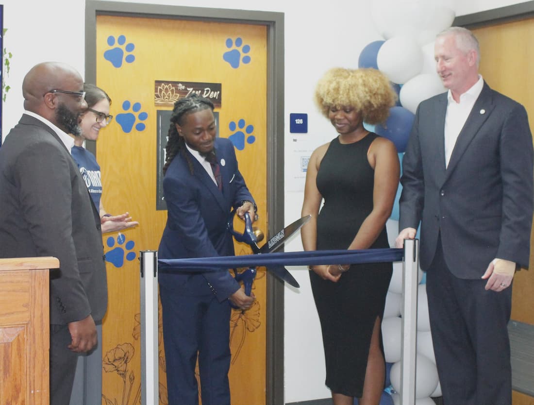 Lincoln University of Missouri students and faculty cut a blue ribbon during the Zen Den ribon-cutting ceremony on August 19. 