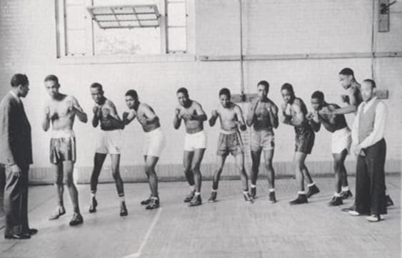 Black and white image of Lincoln University of Missouri boxers standing in a line.