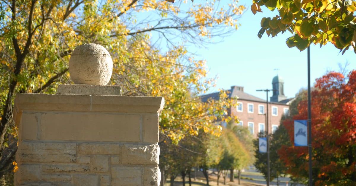 Stone column at Lincoln University of Missouri campus entrance in fall