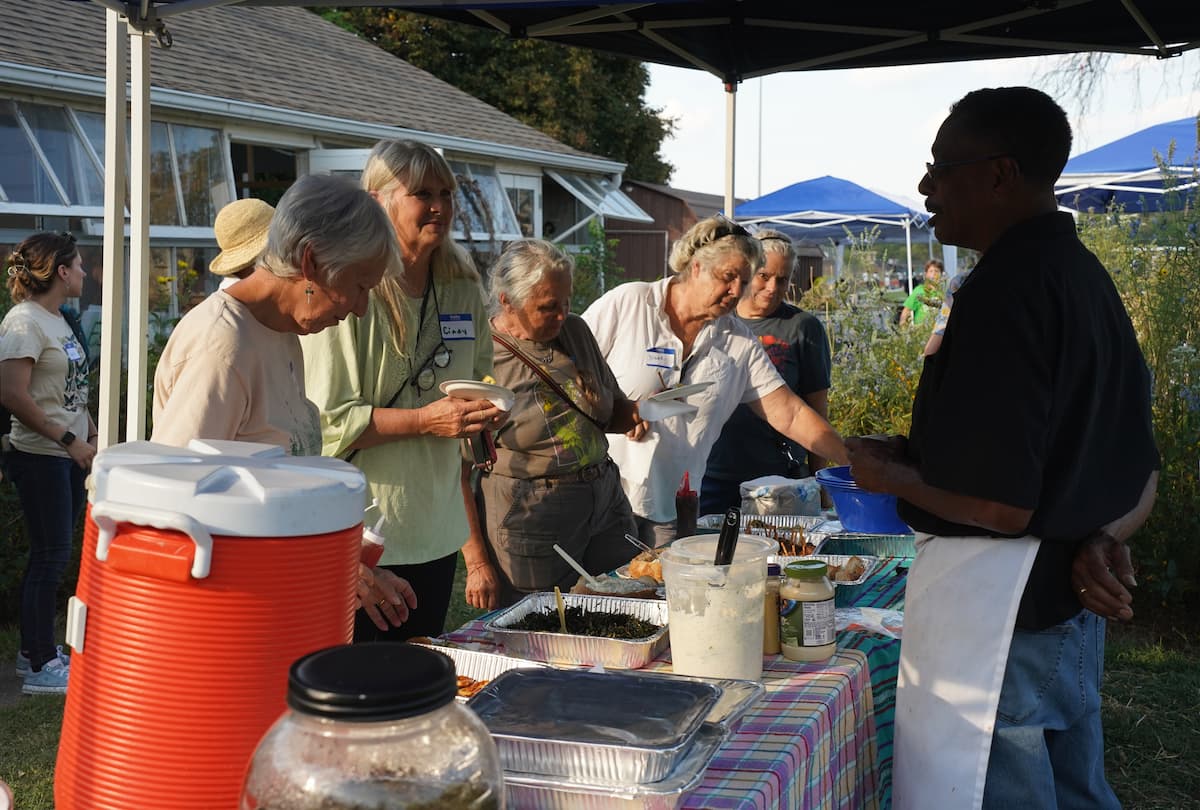 Chef Robert Rusan of St. Louis serves native plant dishes to guests. 