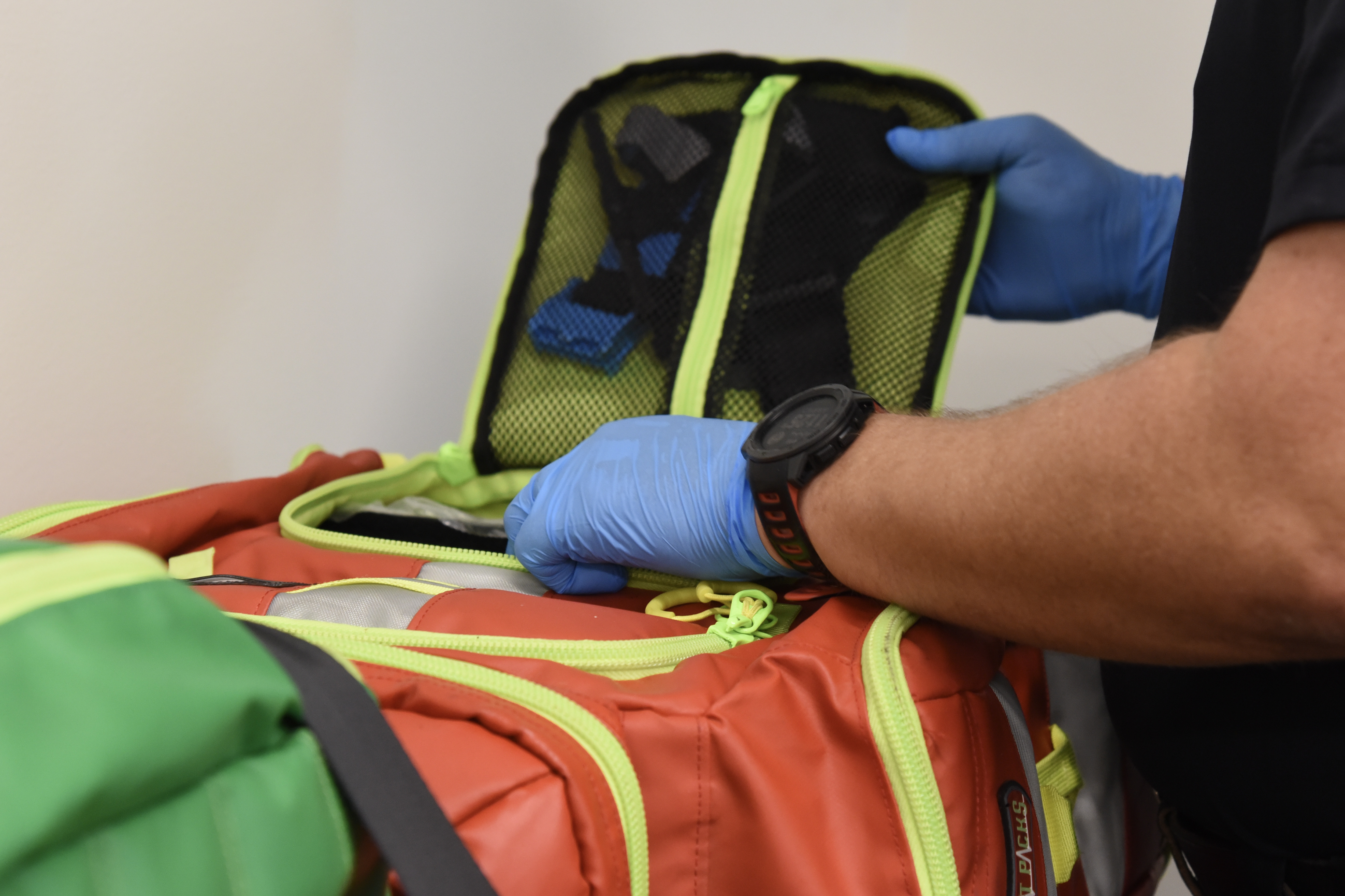 Image of an EMT student loading their emergency response bag