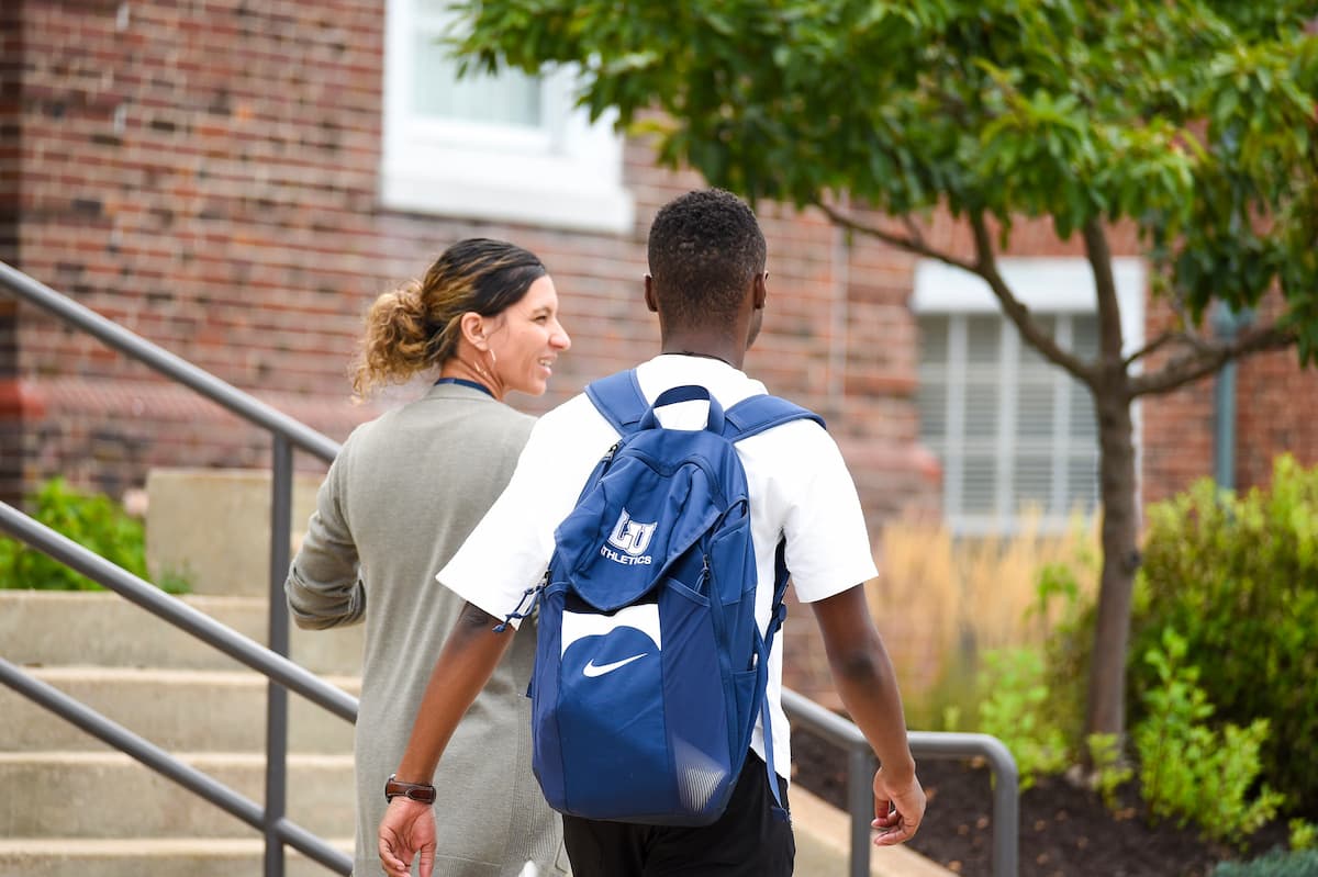 A Lincoln University of Missouri student walks on campus with their LU branded backback.