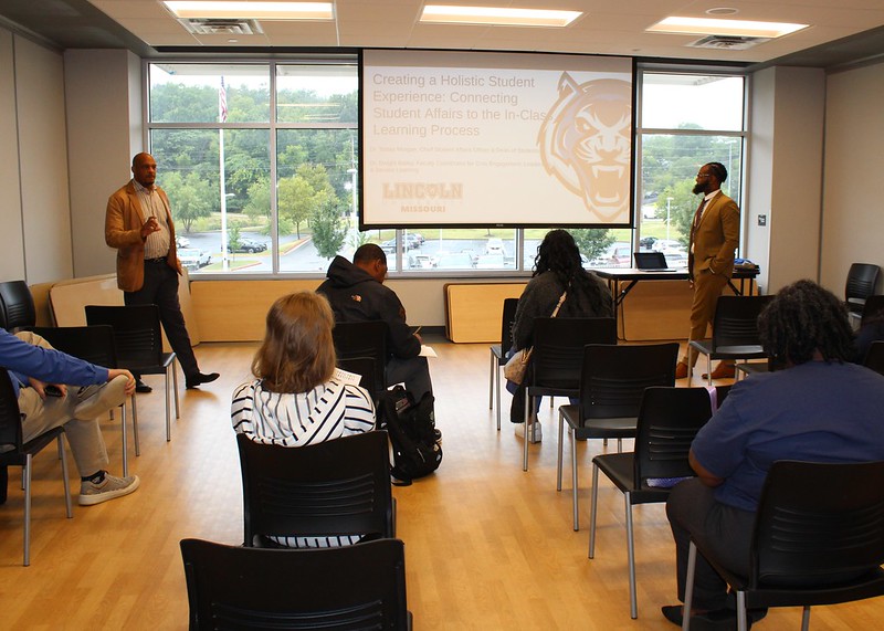 Lincoln University of Missouri faculty sit in a classroom looking at a screen during a presentation.