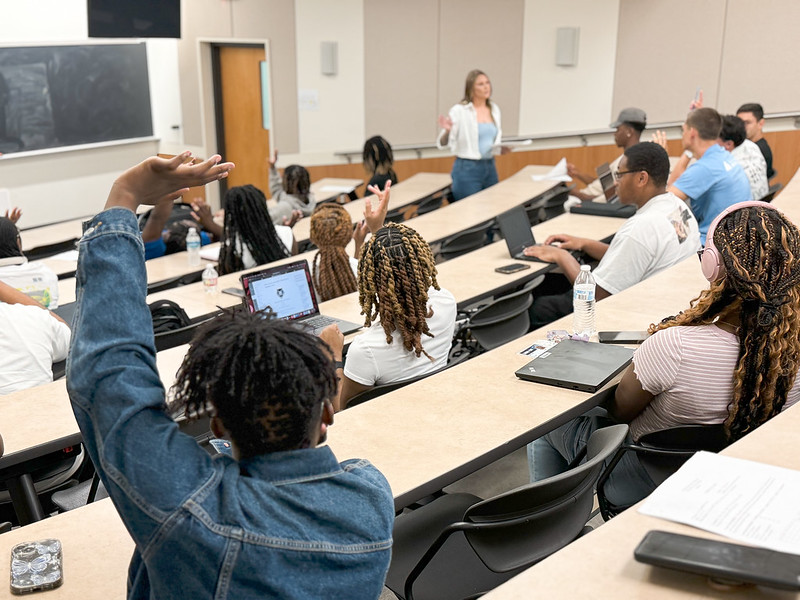 Lincoln University of Missouri students sit in tiered desks in a classroom. 