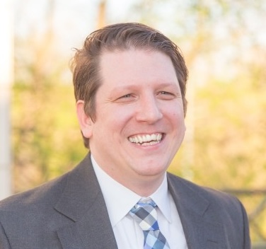 Headshot of Joshua Dunne.
