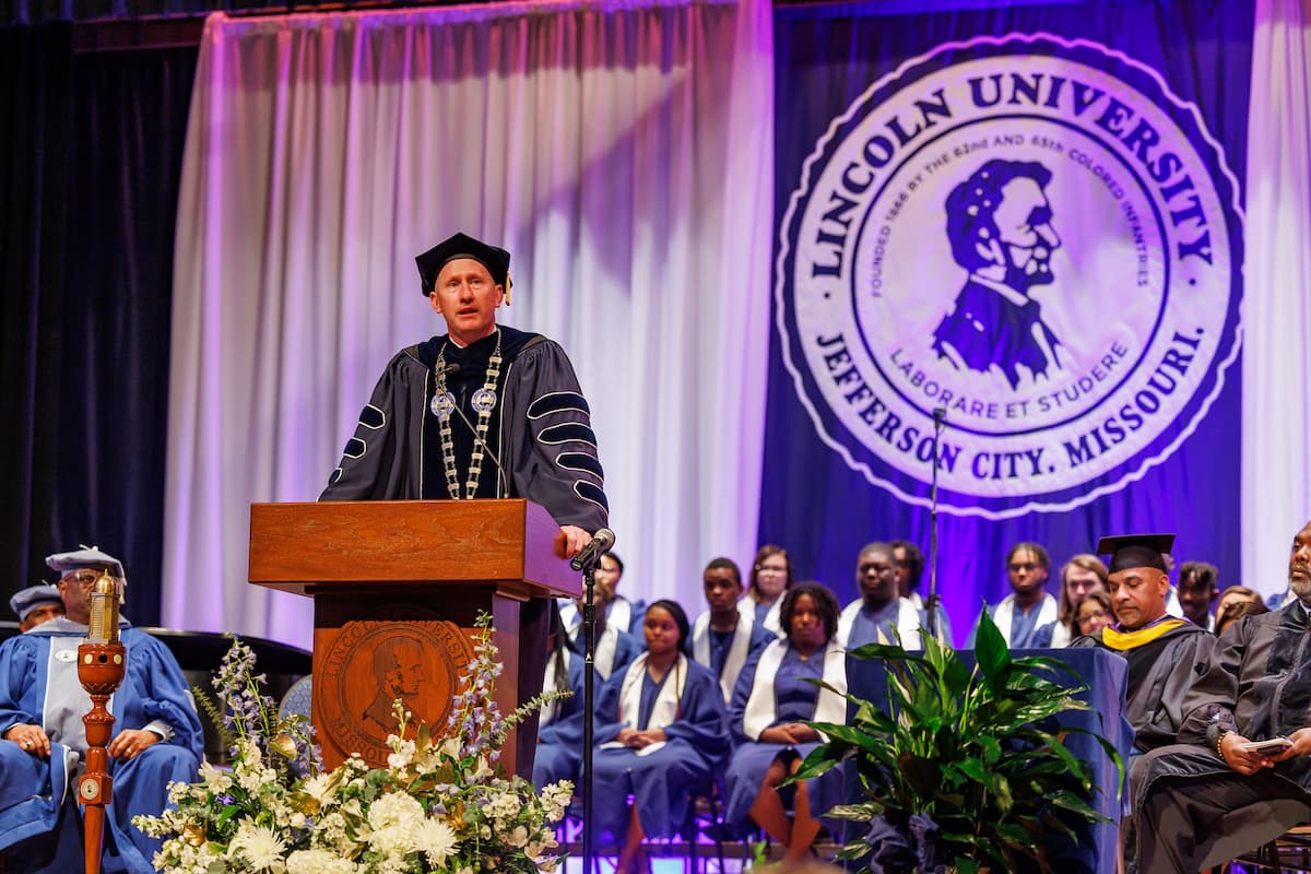 President John Moseley addresses the crowd following the investiture ceremony.