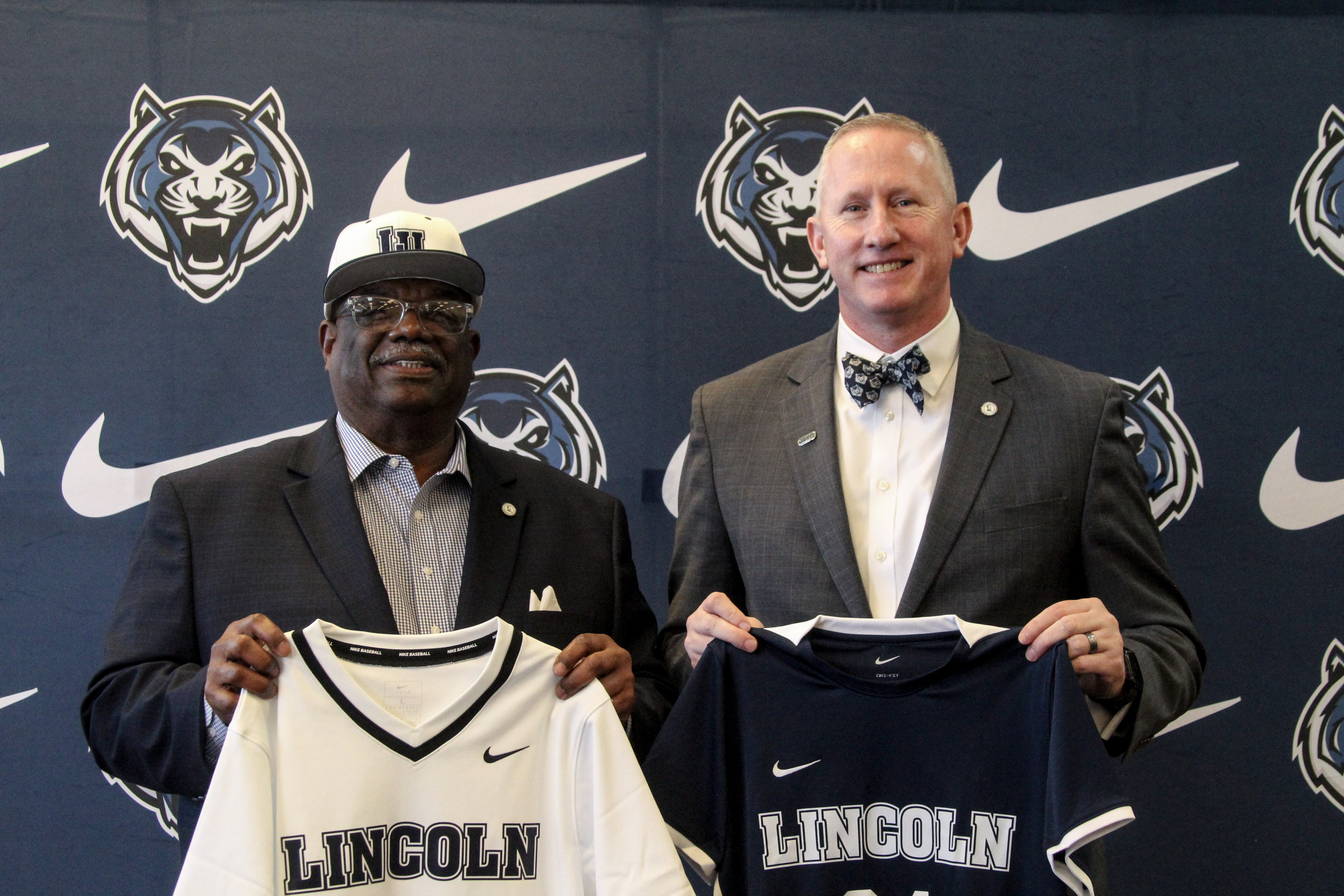   Above, LU Board of Curators President Victor Pasley and LU President Moseley display new LU Blue Tigers athletic jerseys.