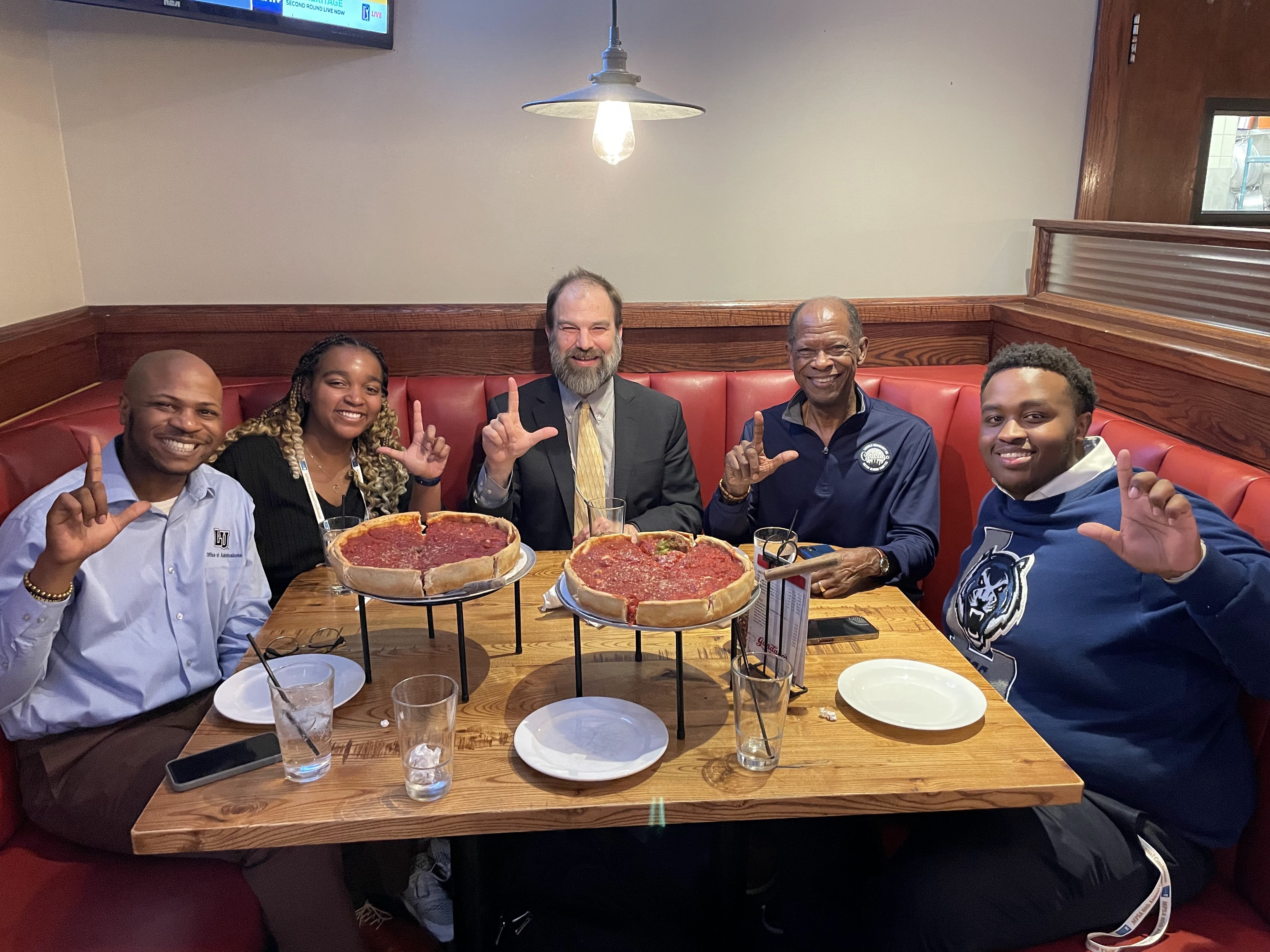 At dinner with LU community (from left to right): LU Chicago alumni chapter leader Lionel Harris, Nia Walker, Associate Professor of Political Science Dr. Brian Norris, LU Chicago-based recruiter Davion Thomas and Alexandre Mugisha.