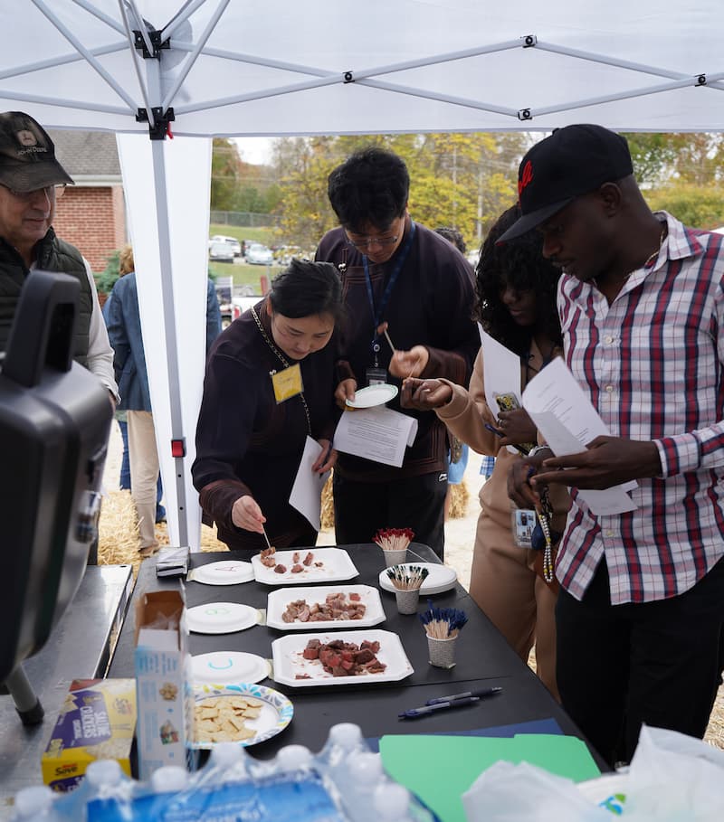 Finca Fest attendees sample various sustainably produced meets