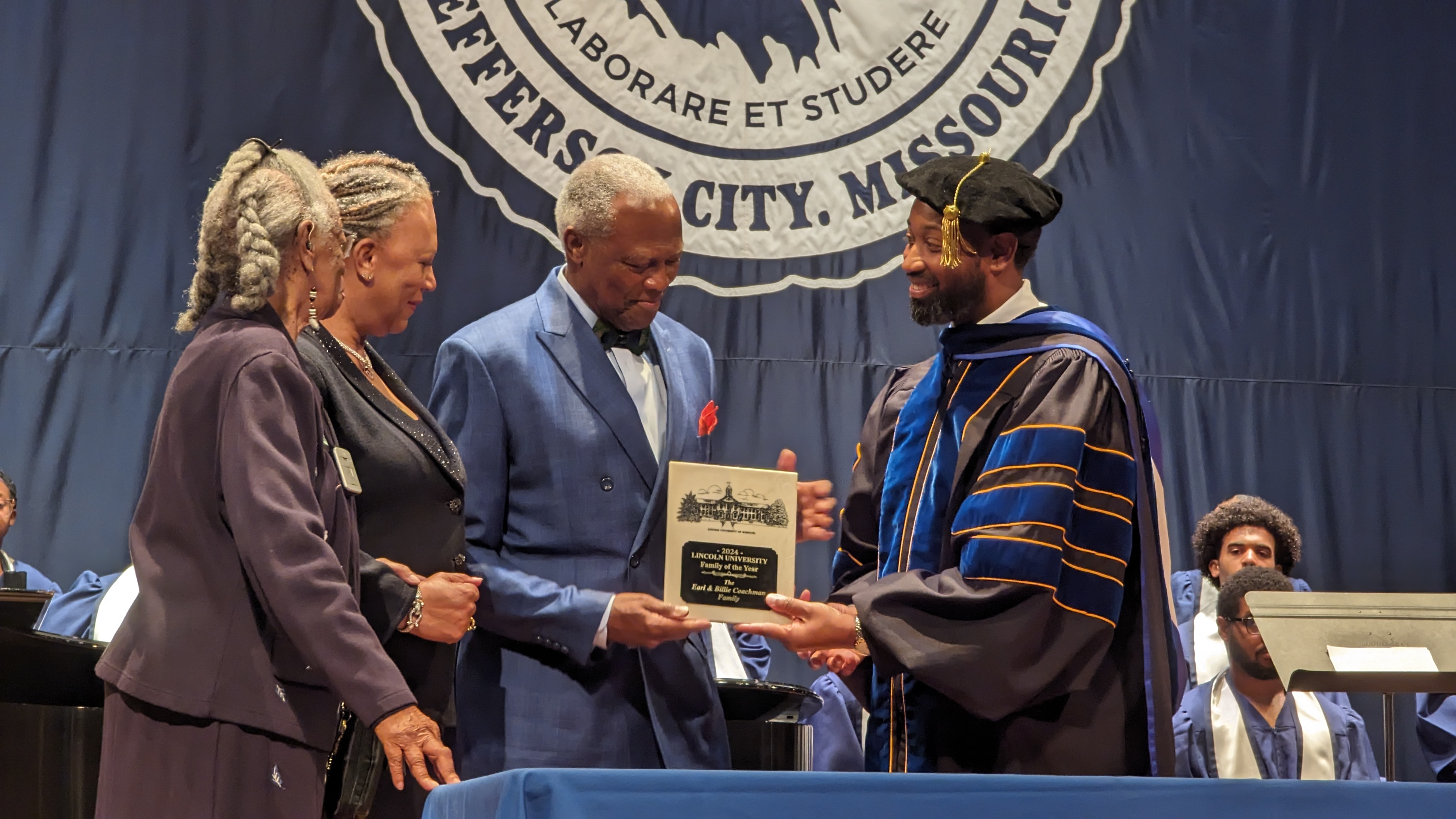Earl and Bille Coachman, along with Billie’s mother, Frances Regina Robinson, are honored by Acting President Dr. Stevie Lawrence II as the 2024 Family of the Year. Ryan Pivoney, Jefferson City News Tribune. 