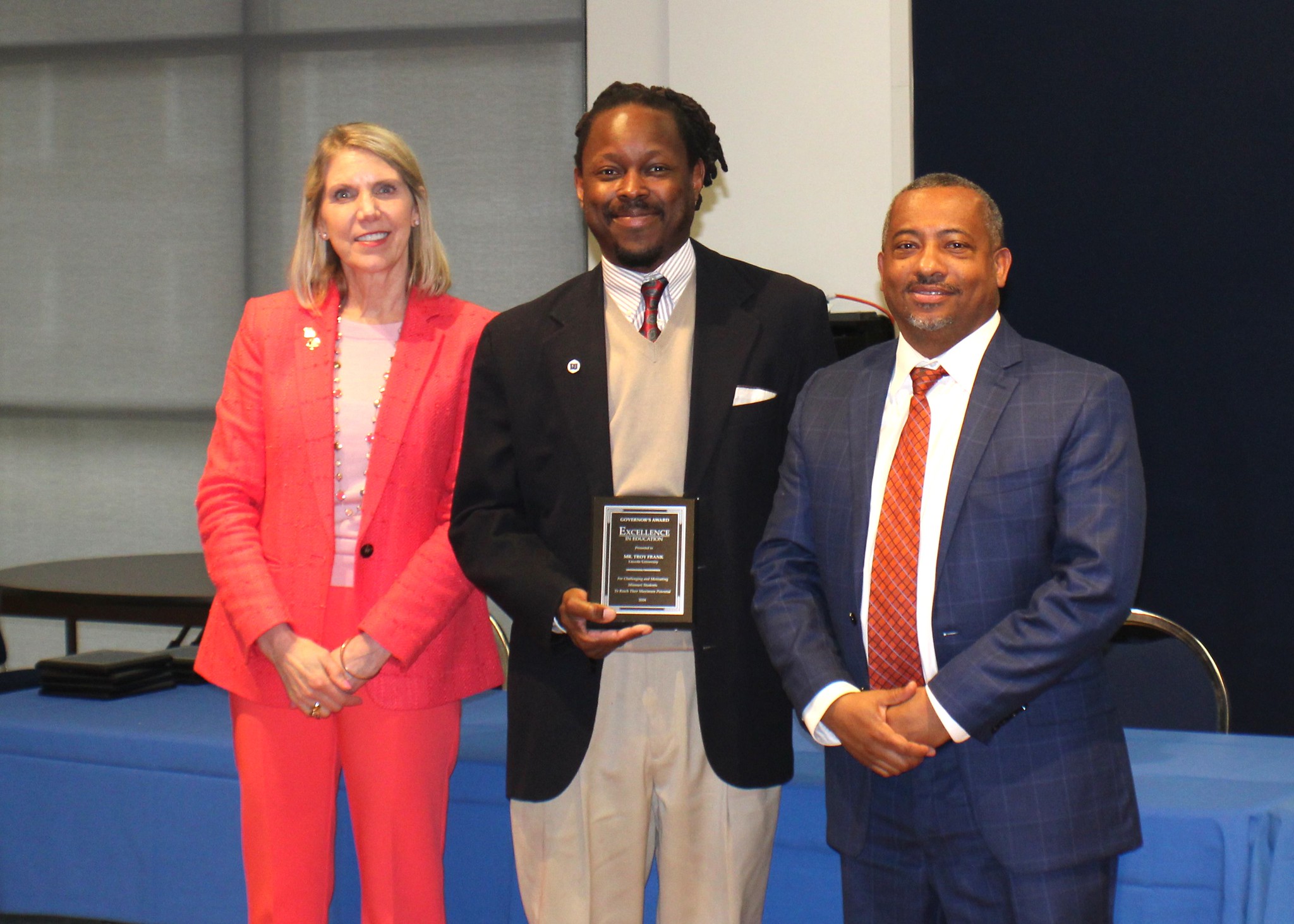 Dr. Troy D. Frank, associate professor of business at Lincoln University of Missouri, has been recognized with the prestigious 2024 Governor’s Award for Excellence in Education. Left to right: Dr. Elizabeth Kennedy, vice chair of COPHE and president of Missouri Western University, Dr. Frank and Carlos Graham from Campus, Community and Government Relations.
