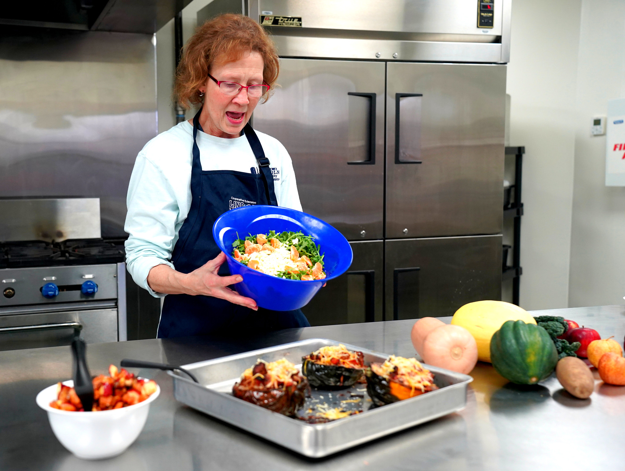 Sarah Eber, LUCE's human health and nutrition program coordinator, demonstrates the art of preparing a vibrant and nutritious meal during the Plant, Grow, Eat, Be Healthy workshop series.
