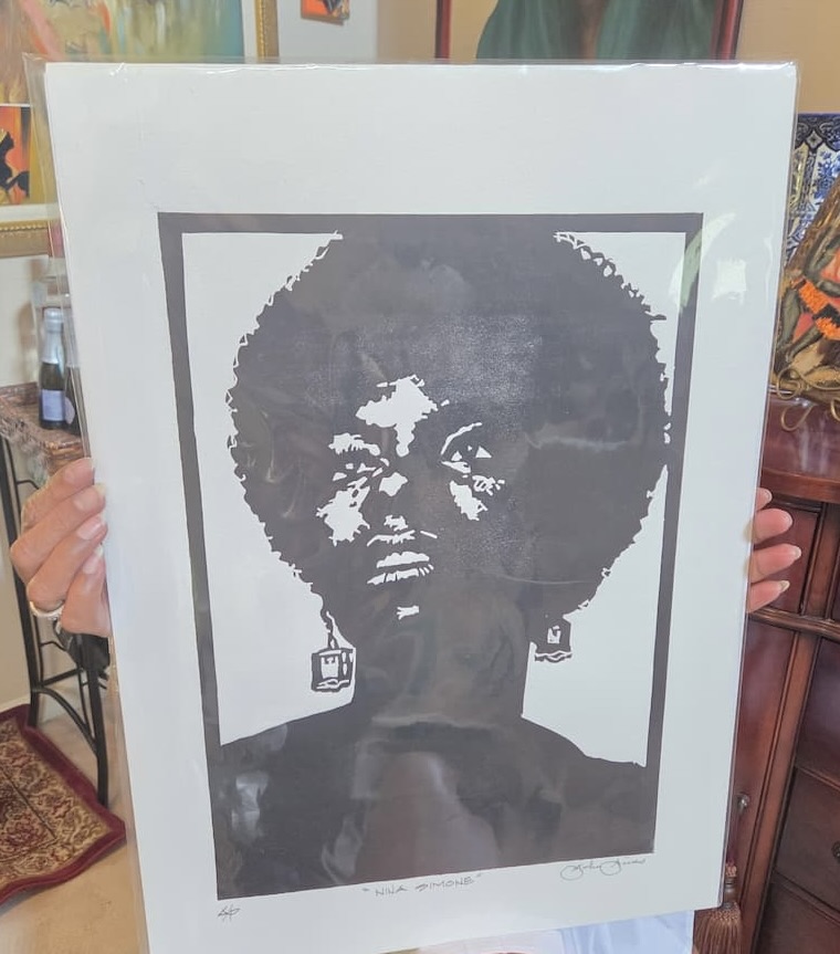 Black and white piece of art of a woman's face.