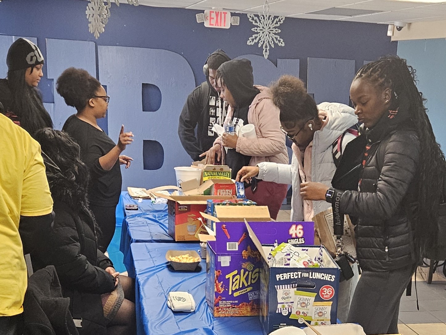 depiction of Lincoln University of Missouri students participate in the Take-a-Break Tuesday event, "Power Up for Finals: Personalize Your Snack Bag with Inspiration.”