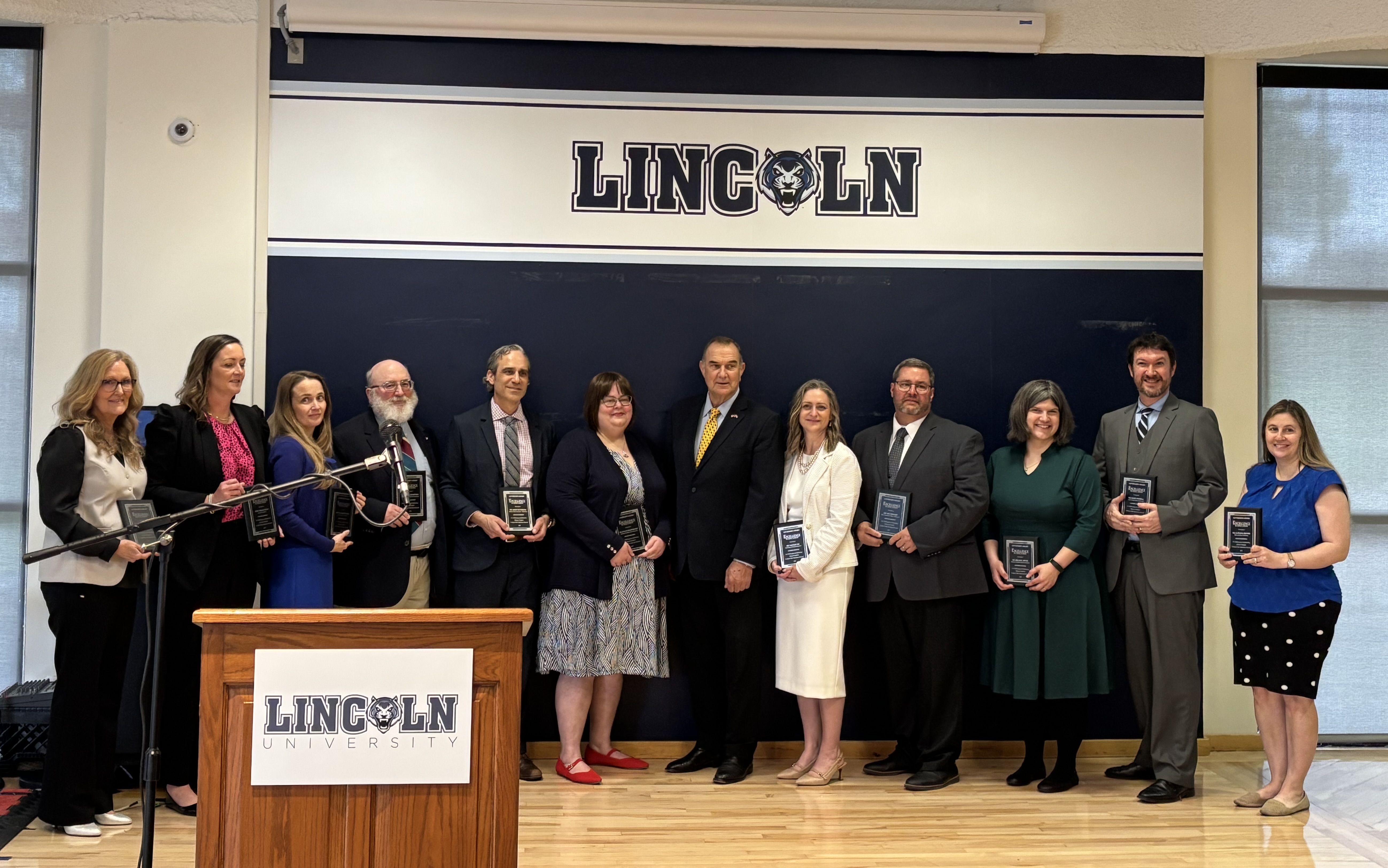 Missouri Governor Mike Kehoe stands with award recipients of the Excellence in Teaching awards. 