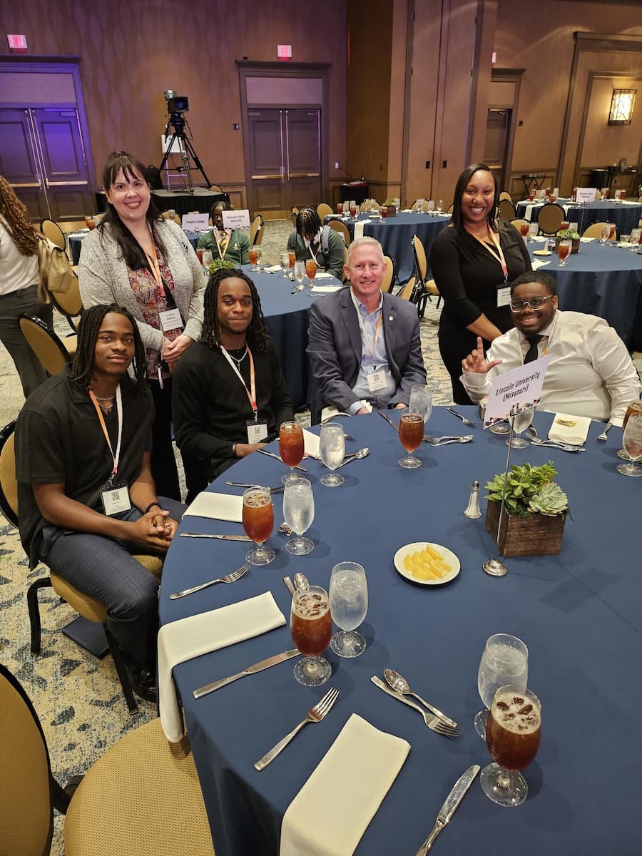 Lincoln University of Missouri Strada Scholars with LU faculty at a banquet event.