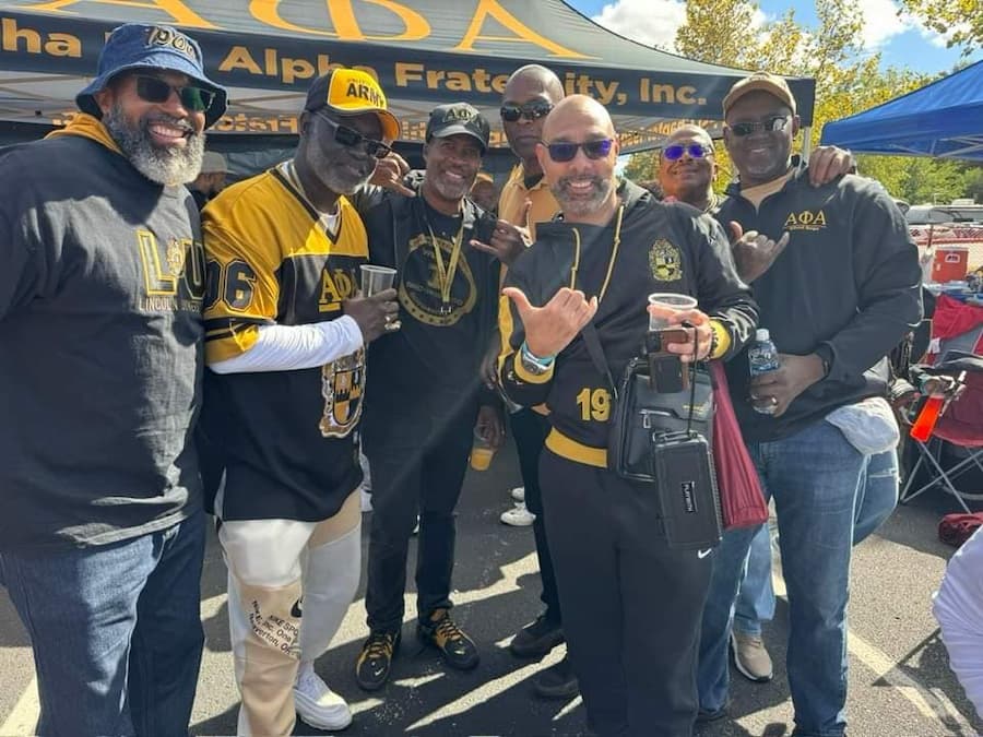 Lincoln University of Missouri fraternity alumni members pose for a picture at a Lincoln University Homecoming event.