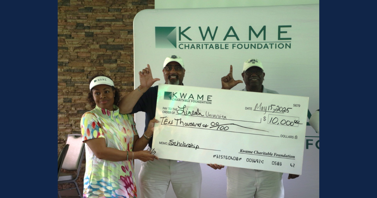 Lincoln University representatives and a Kwame Charitable Foundation member holding a large check for $10,000 during the 21st Annual Golf Tournament.
