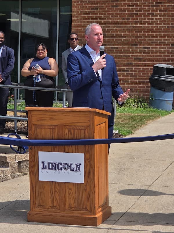 Dr. Moseley at podium, Dawson Hall ribbon-cutting 2025.