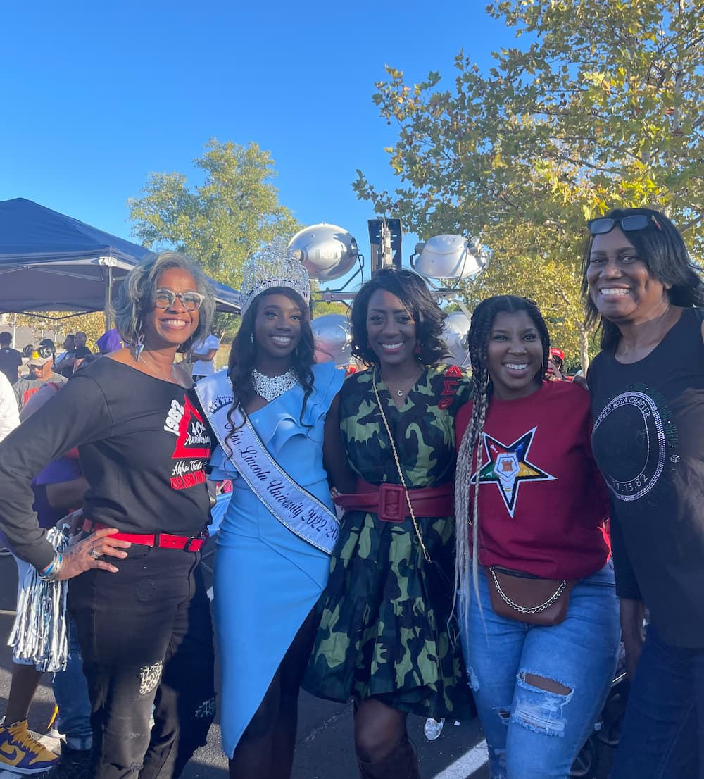 Staci Garrett Oliver stands outside with other former Miss Lincoln University queens.
