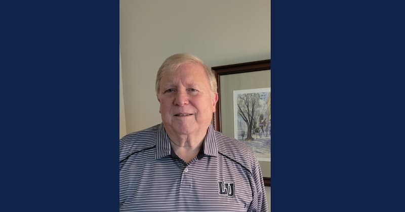 Dennis Strobel, facing forward with a wall behind him.