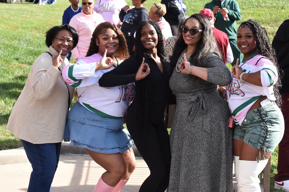 Lincoln University Alumni pose for a photo on the quad during the Greek Serenade.