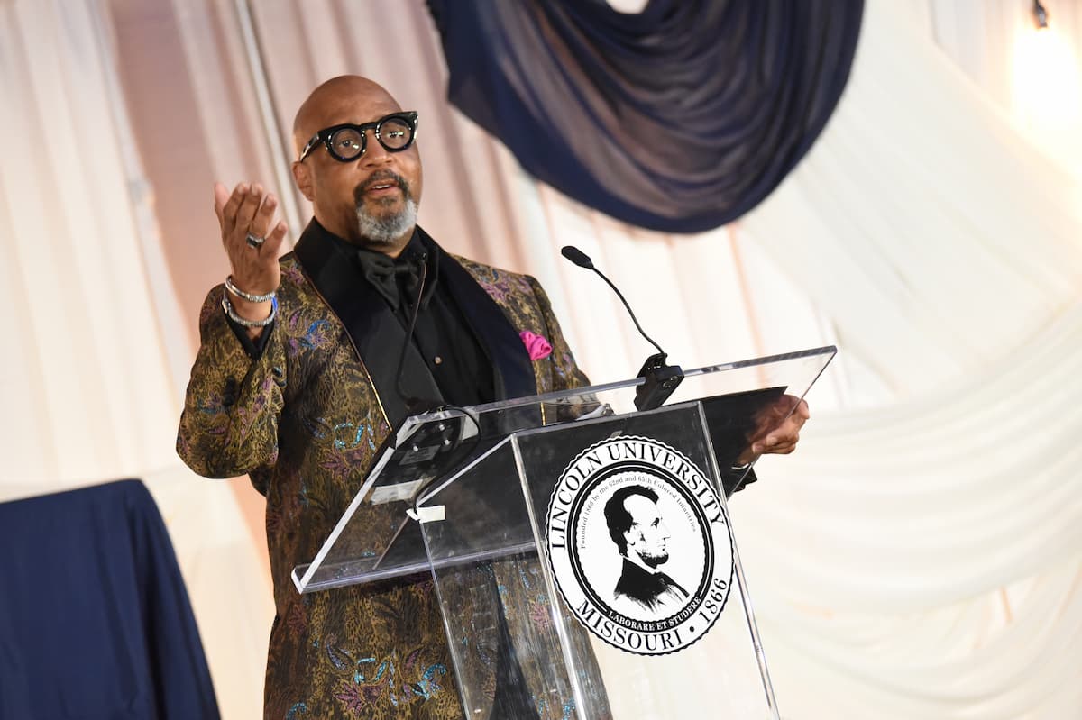 A featured speaker addresses guests at the 2025 Masked Ball, emphasizing the importance of unity, achievement, and community engagement.