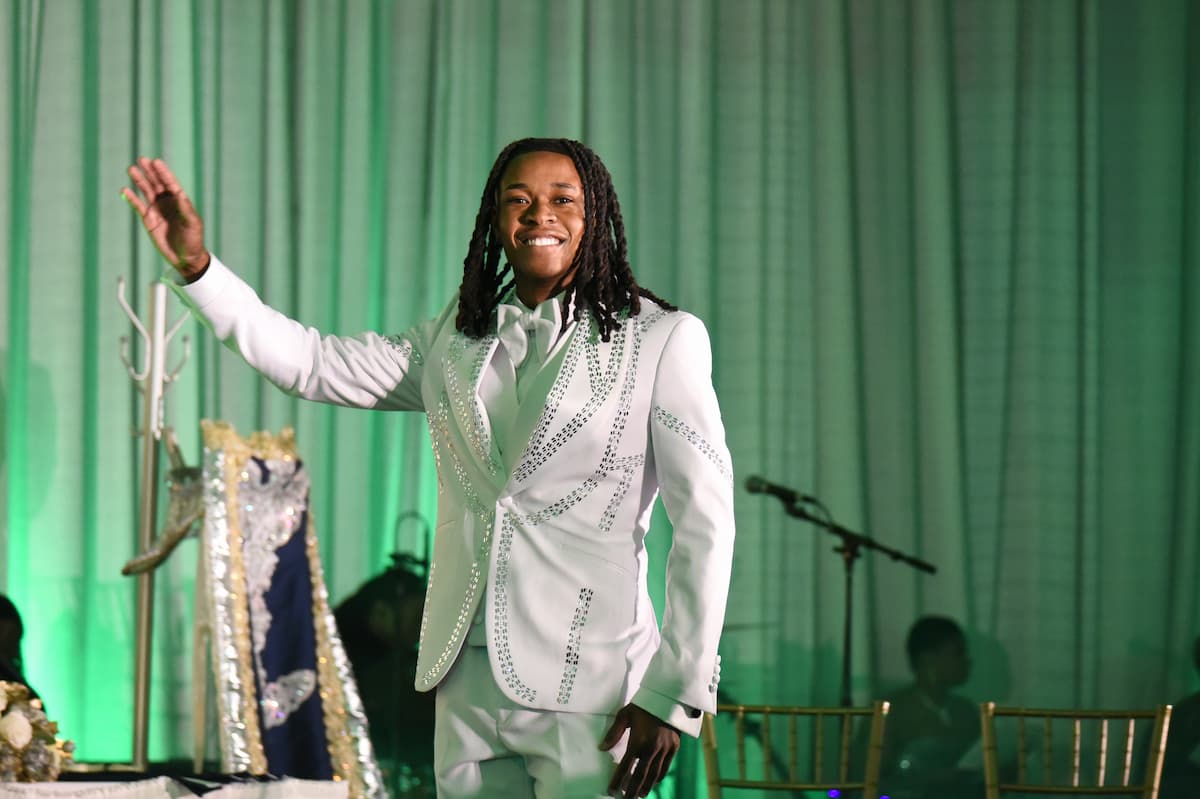 Mister Lincoln University steps forward to greet the audience before the crowning ceremony.