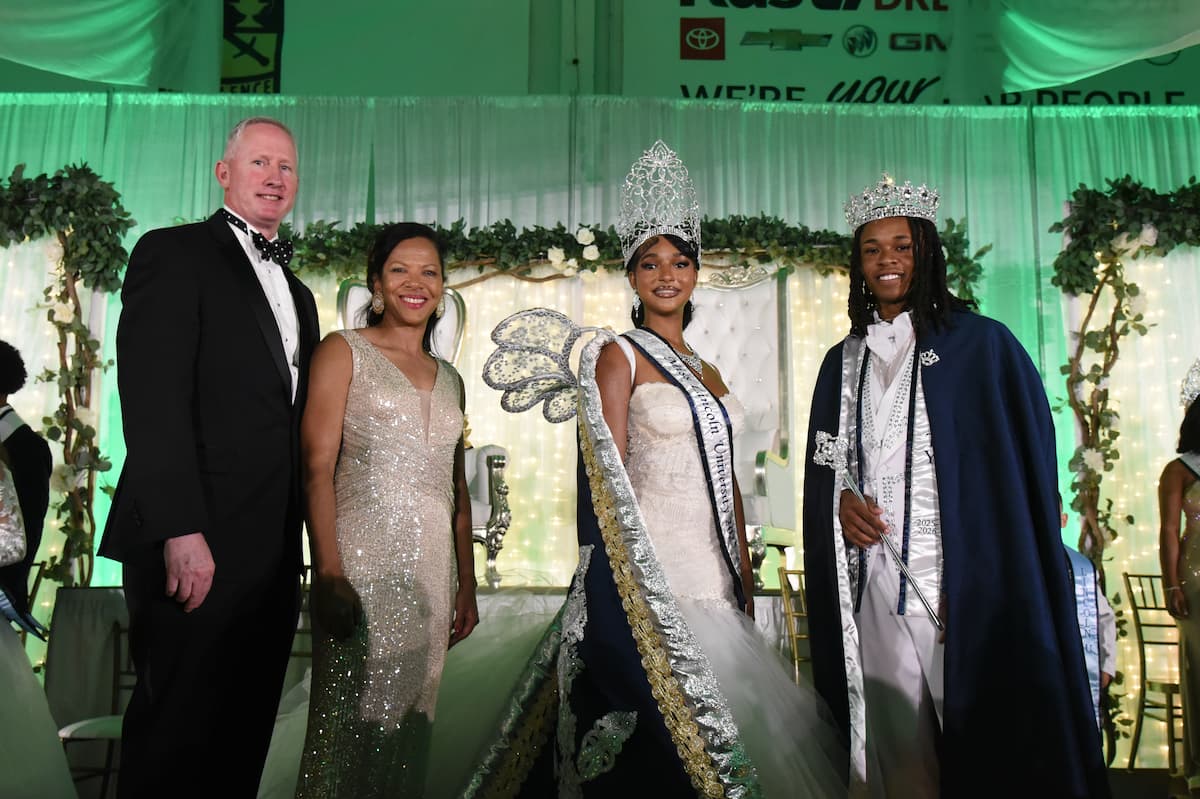 President John B. Moseley and First Lady Crystal Moseley join the newly crowned Mister and Miss Lincoln University on stage.