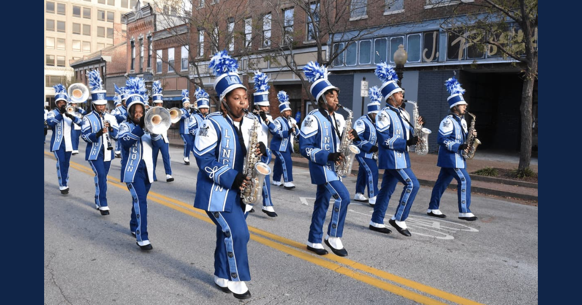 The Lincoln University of Missouri Marching Band marches down the street during the Homecoming parade.