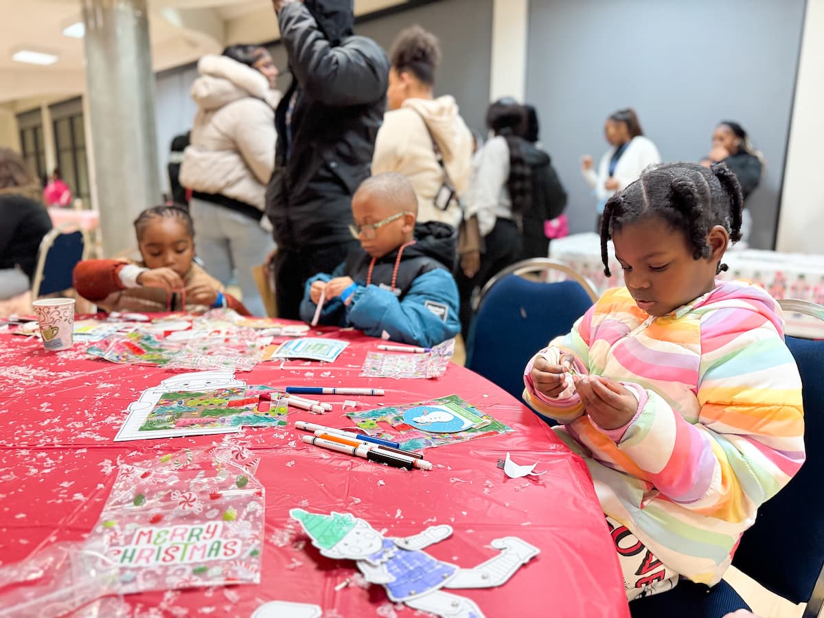 Children decorate Christmas cookies at the Holiday Extravaganza.