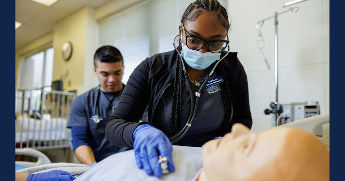 A female nurse uses a stethoscope to listen to the heartbeat of a nursing simulation dummy. 