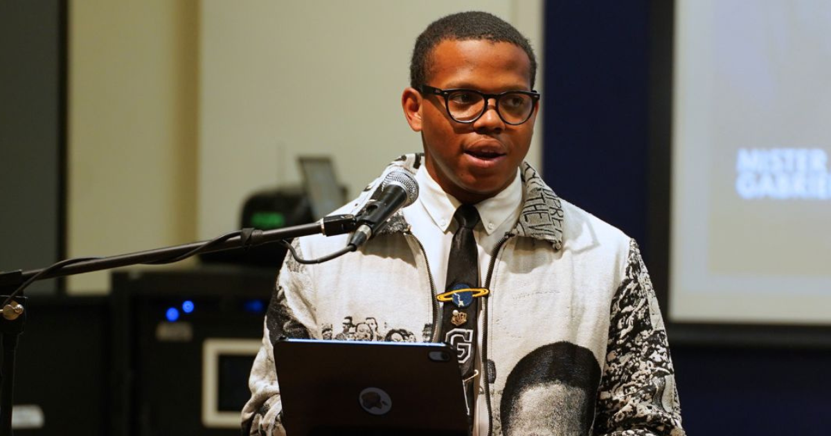 A man standing behind a podium.