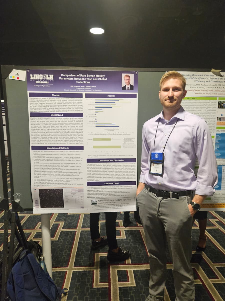A person standing in front of a scientific research poster titled “Comparison of Ram Semen Motility Parameters between Fresh and Chilled Collections.”
