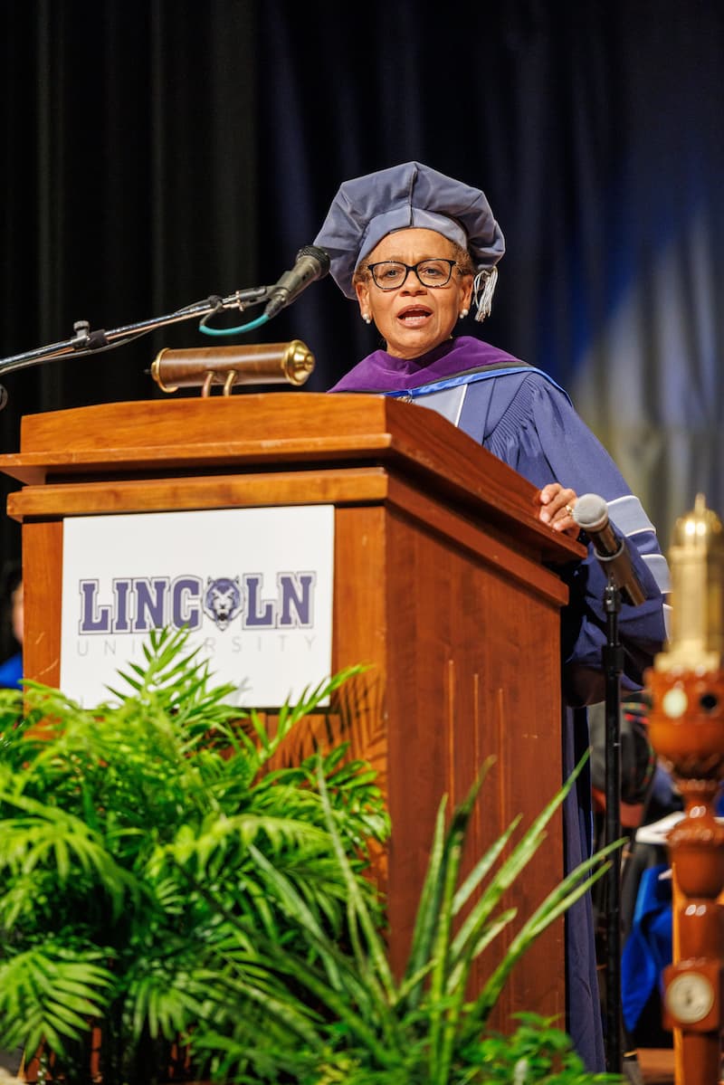 Chief Hudson stands at the podium while giving a speech at the Honors Convocation at LU.