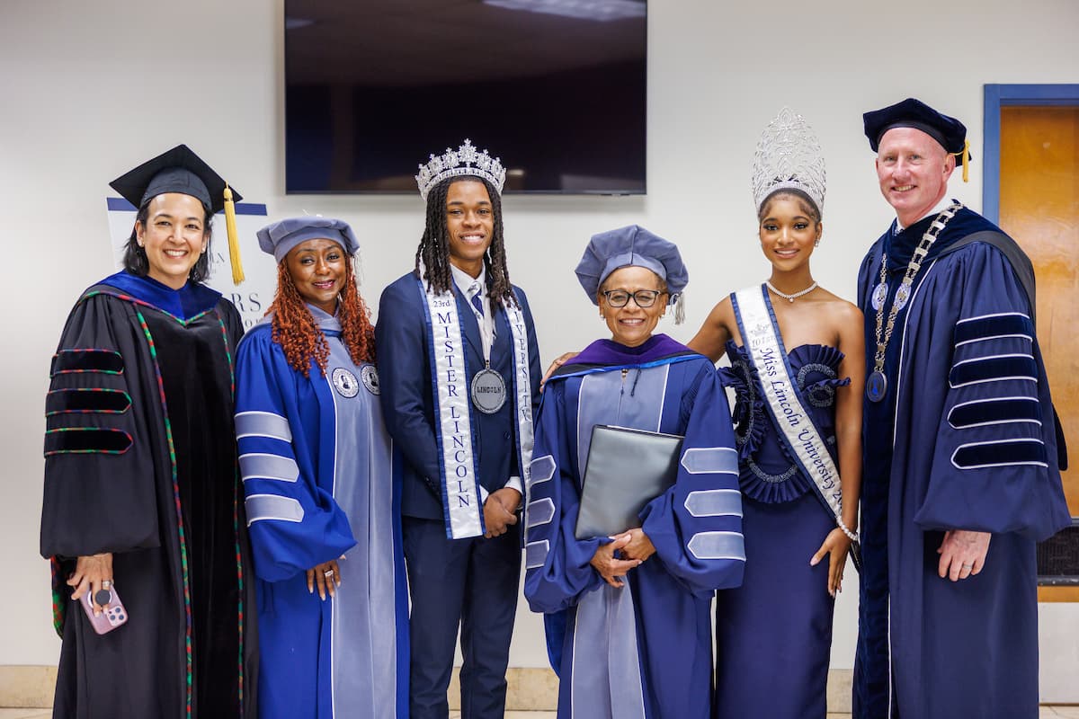 Lincoln University faculty stand in a line in university regalia at the 2026 Honors Convocation.