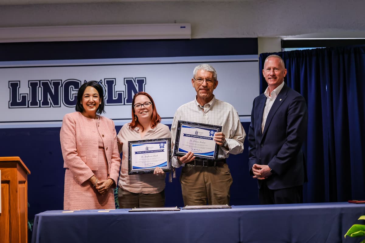 President Moseley with Stephanie Clark and Adrian Andrei.