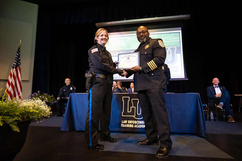Lincoln University Law Enforcement Training Academy graduate receives a certificate during the Recruit Class #2026-19 ceremony.