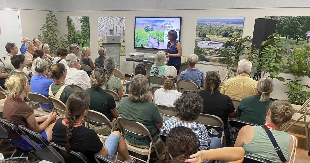 Nadia Navarrete-Tindall gives a presentation on native plants to a seated audience during Forrest Keeling Nursery’s annual field day.