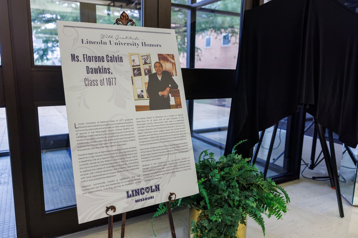 A poster displayed at the Dawkins art exhibit shows information about Florene Dawkins.